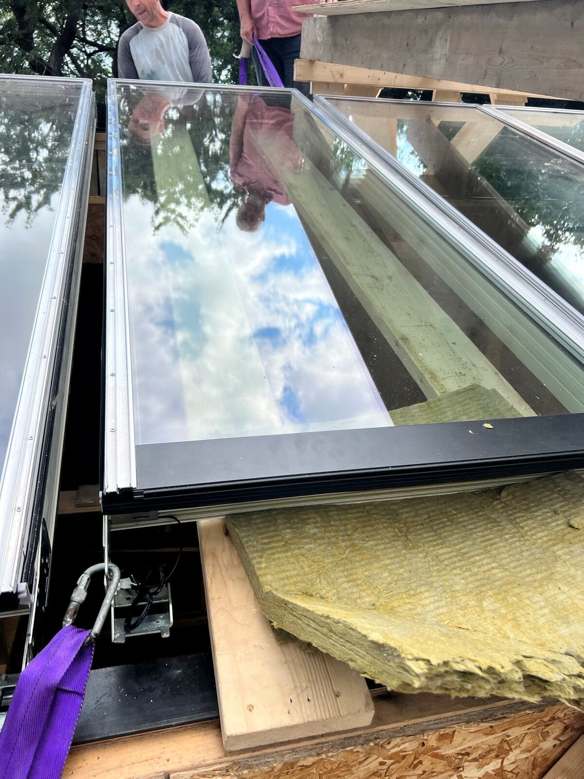 VELUX Modular Skylight glass module being set on a commercial roof &mdash; Well Roofing project