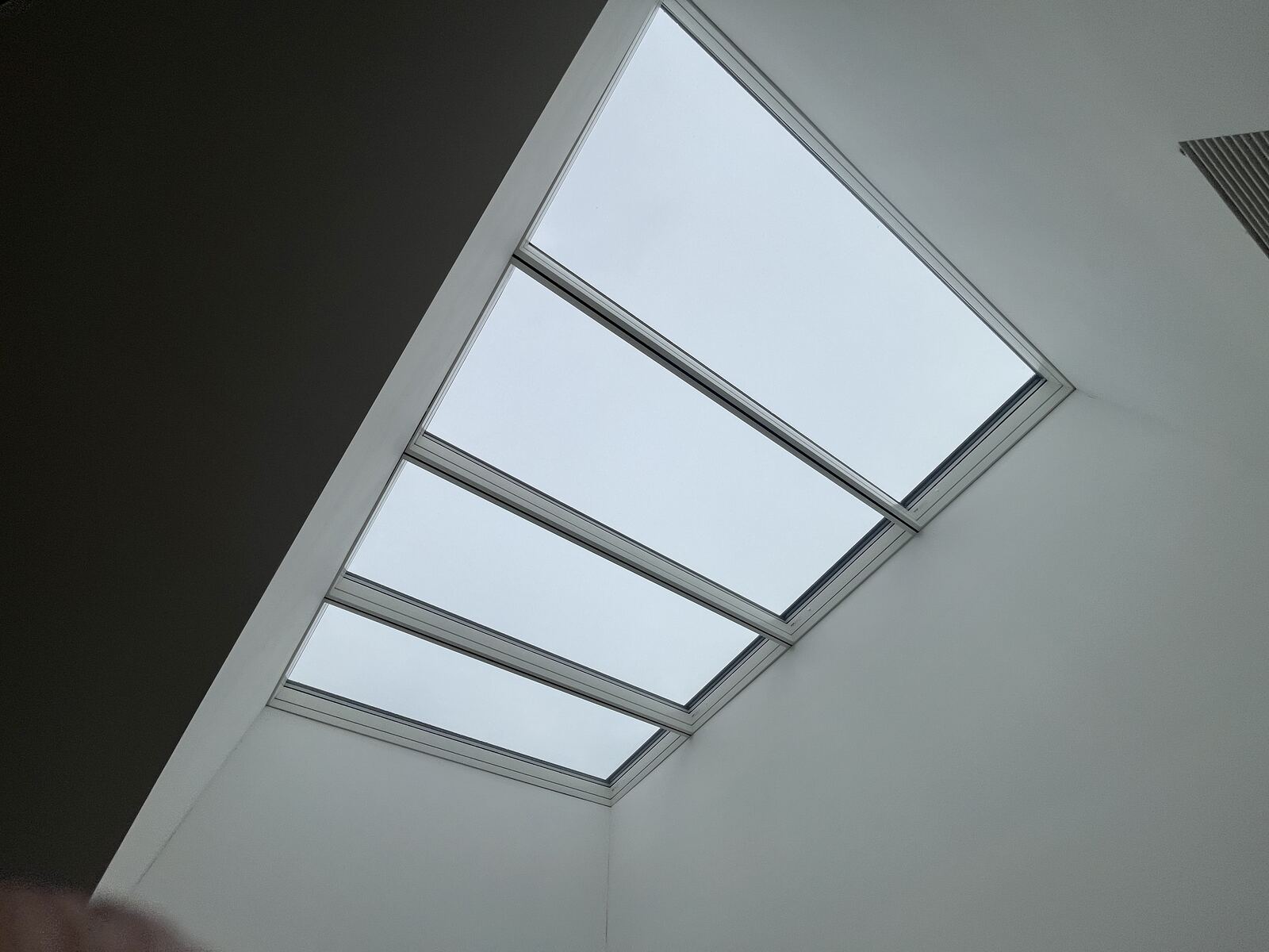 Finished VELUX Modular Skylight longlight seen from inside a commercial interior