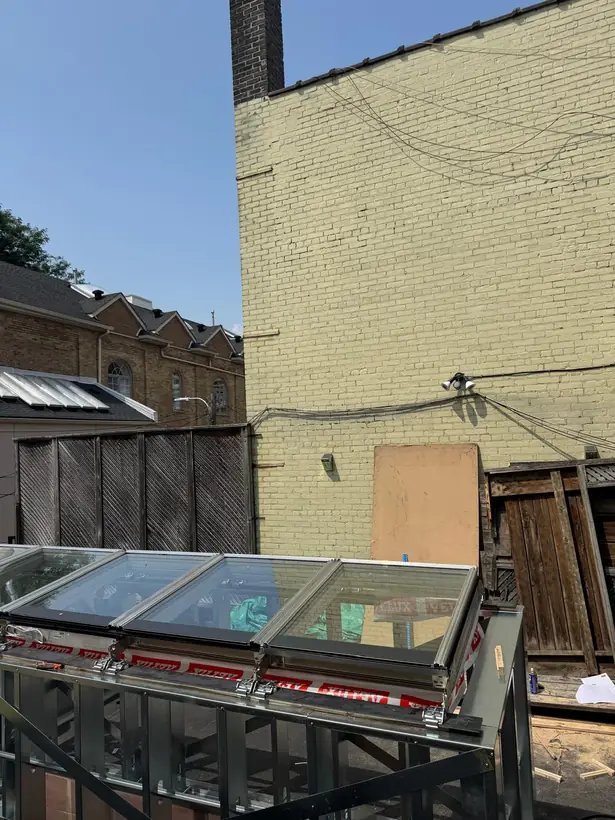 Longlight VELUX Modular Skylight installation by Well Roofing — Longlight on a rear addition