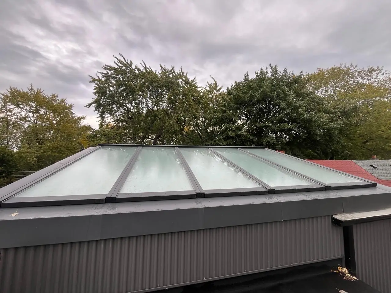 Longlight VELUX Modular Skylight installation by Well Roofing — Morse Street, photograph 1