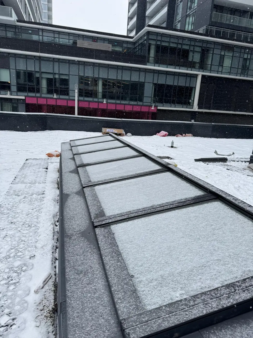 Longlight VELUX Modular Skylight installation by Well Roofing — Longlight on a condo roof, photograph 1