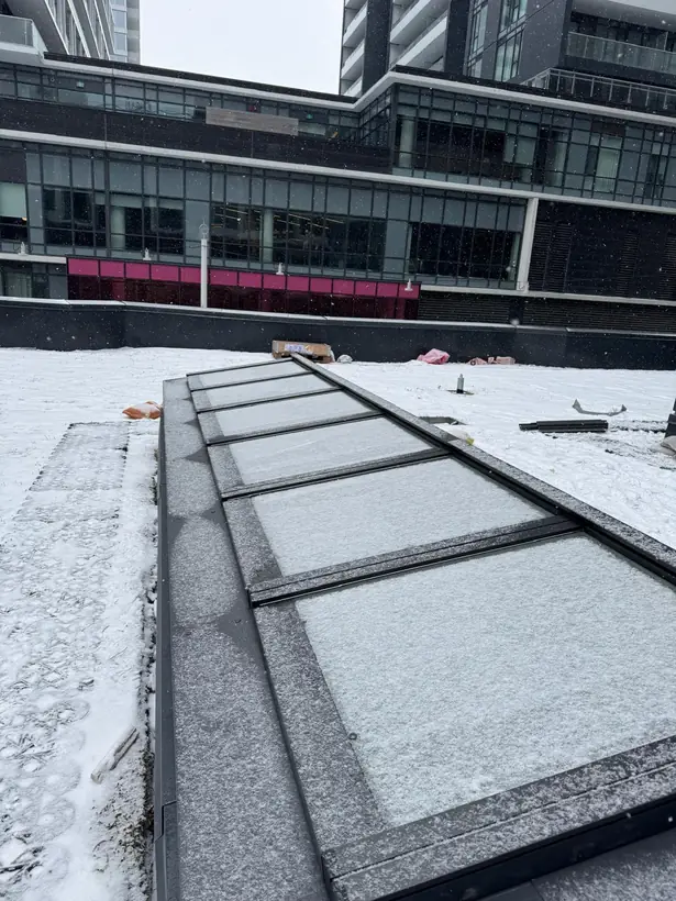 Longlight VELUX Modular Skylight installation by Well Roofing — Longlight on a condo roof, photograph 1