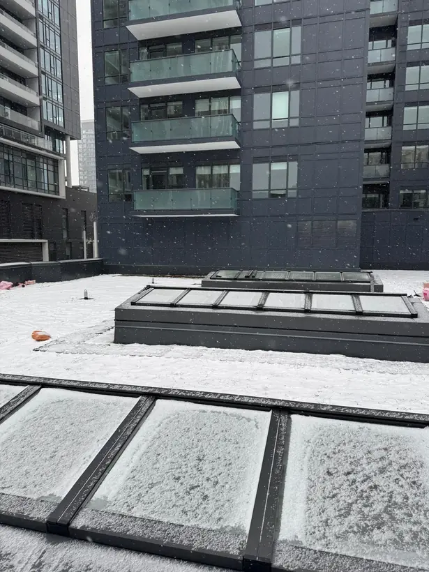 Longlight VELUX Modular Skylight installation by Well Roofing — Longlight on a condo roof, photograph 2
