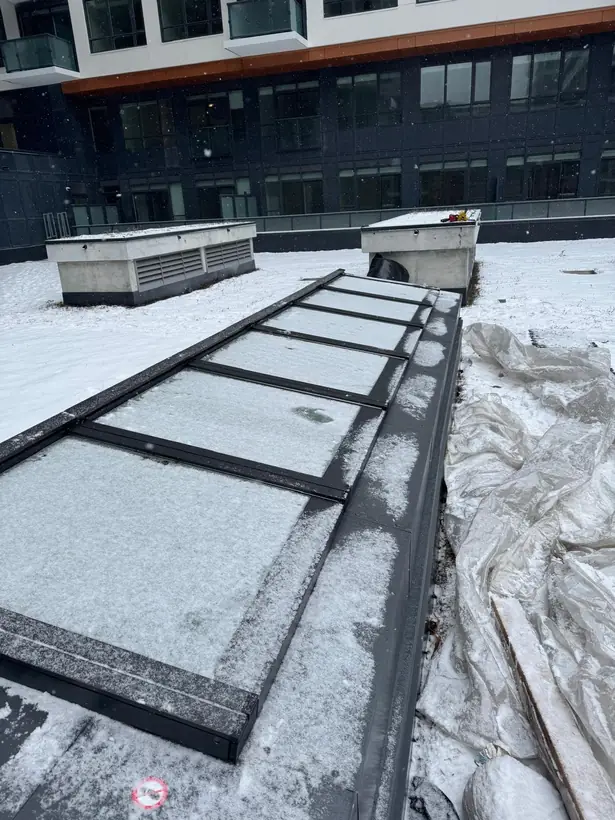 Longlight VELUX Modular Skylight installation by Well Roofing — Longlight on a condo roof, photograph 3