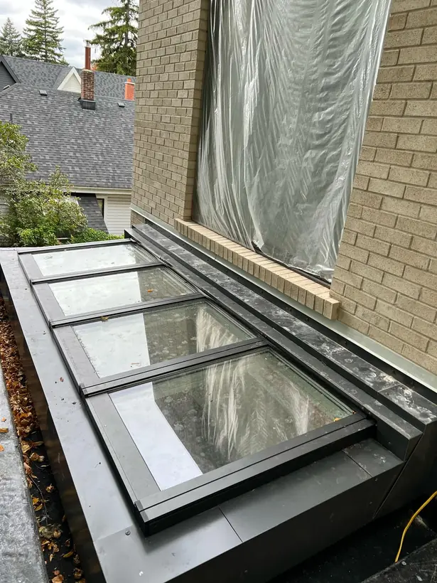 Wall-mounted Longlight VELUX Modular Skylight installation by Well Roofing — Wall-mounted Longlight, photograph 1