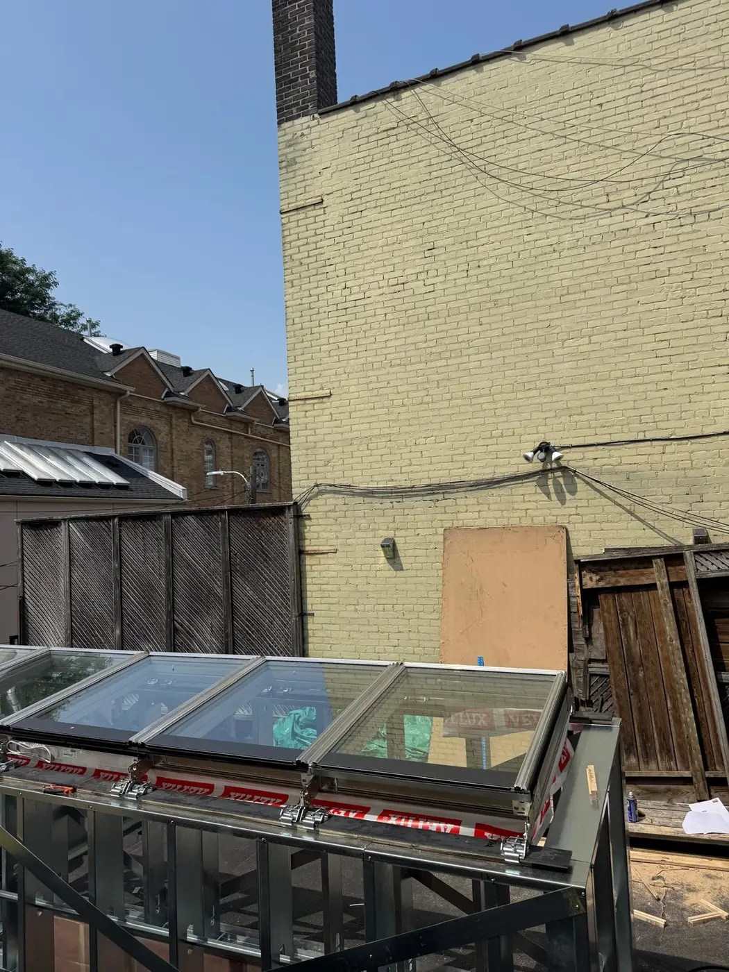 Longlight VELUX Modular Skylight installation by Well Roofing — Longlight on a rear addition, photograph 1